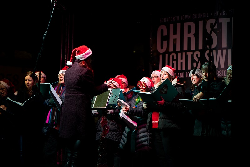 Love Pop Choir perform on the stage at the Christmas lights switch on in Horsforth